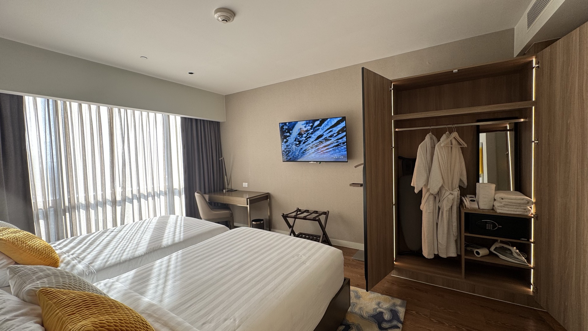 Bright suite interior showing a calm hotel residence setting.